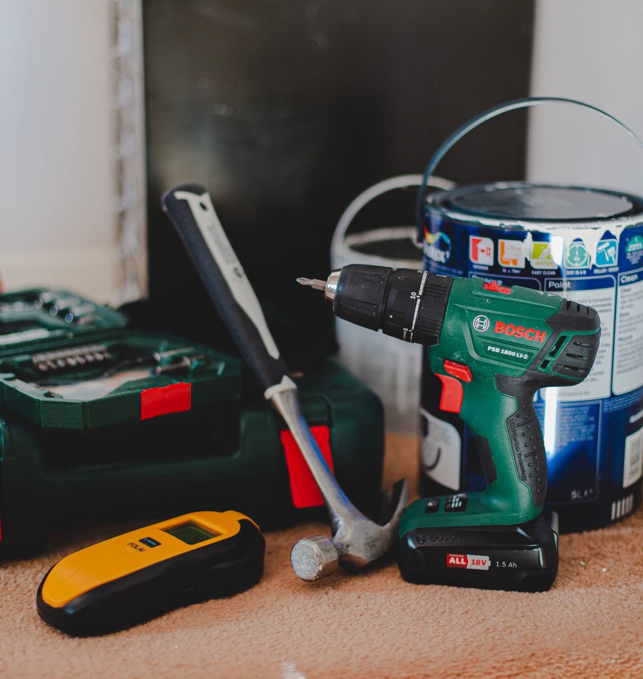 A drill, hammer, and paint supplies — the home improvement tools Handyman of Columbus brings to every job